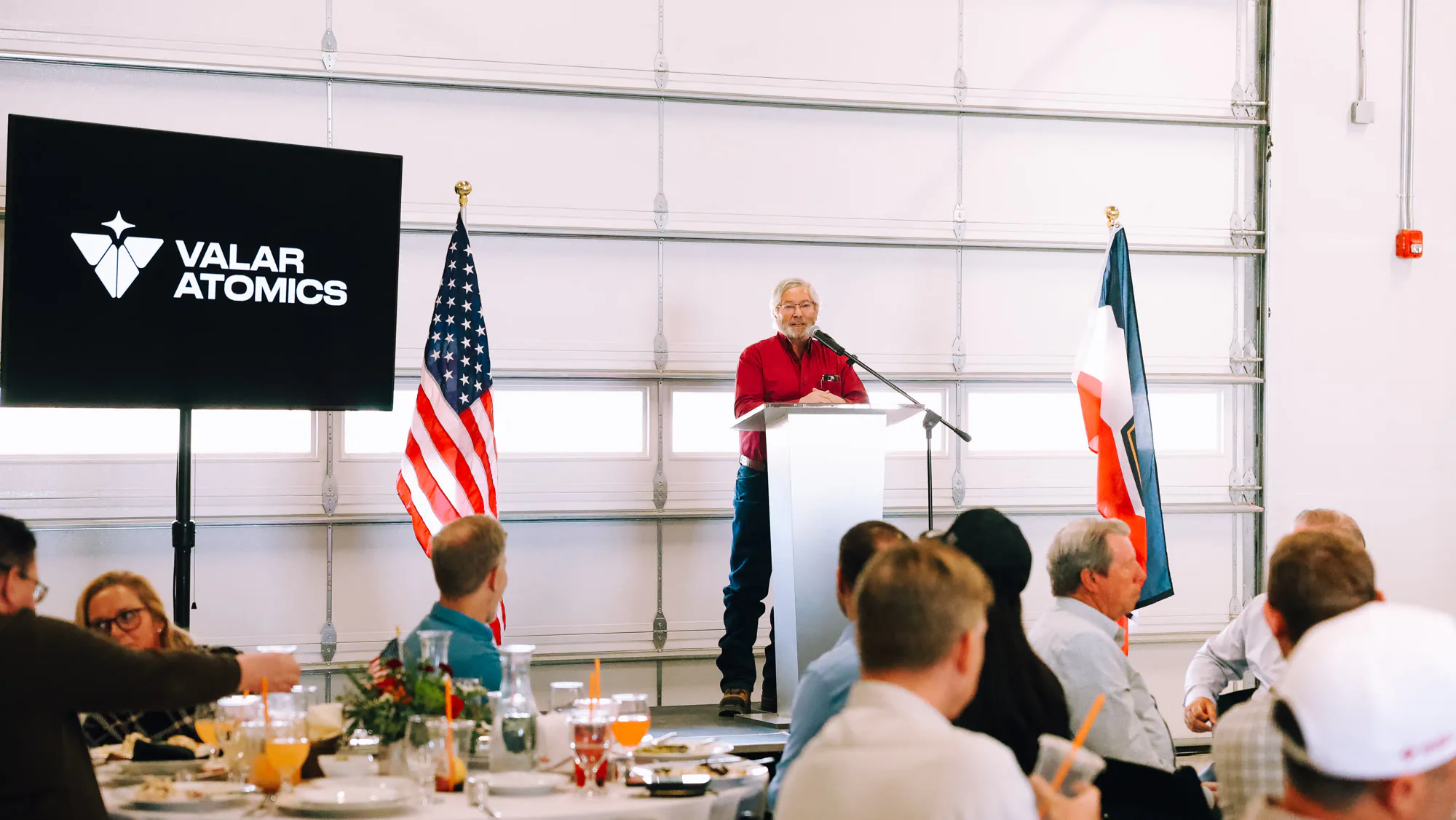 Community dinner with a speaker at the podium